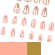 Full set of peach almond press-on nails with rose gold glitter and white floral art